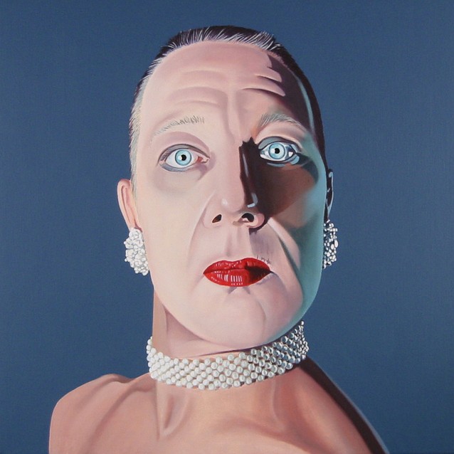 Oil painting by Peter Colstee as a selfportrait as transvestite and looking like a woman with pearl neckless and earrings and red lips in blue background color